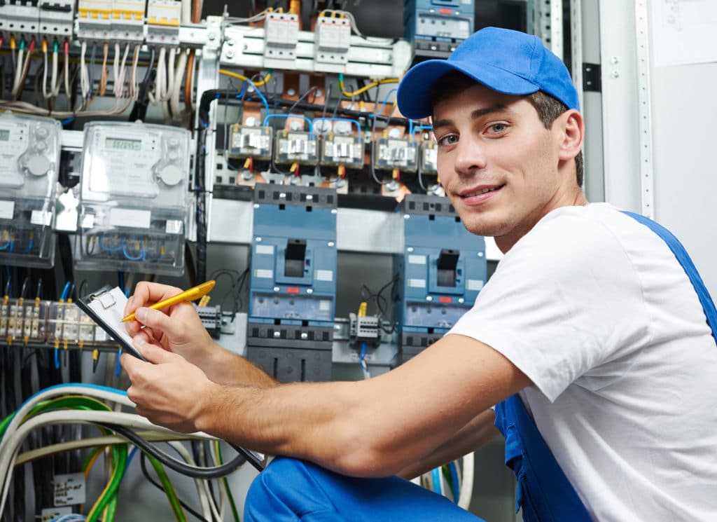 Electrician worker inspecting equipment